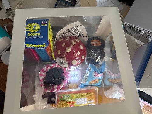 Example custom gift box with confectionery, a maze puzzle and decorative items; contents sold separately
