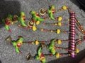 Colourful parrot and bell hanging decoration