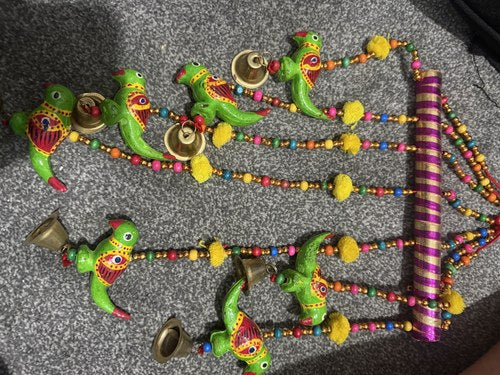 Colourful parrot and bell hanging decoration