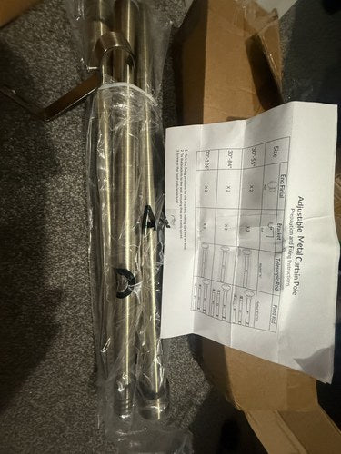 Gold-tone adjustable curtain pole