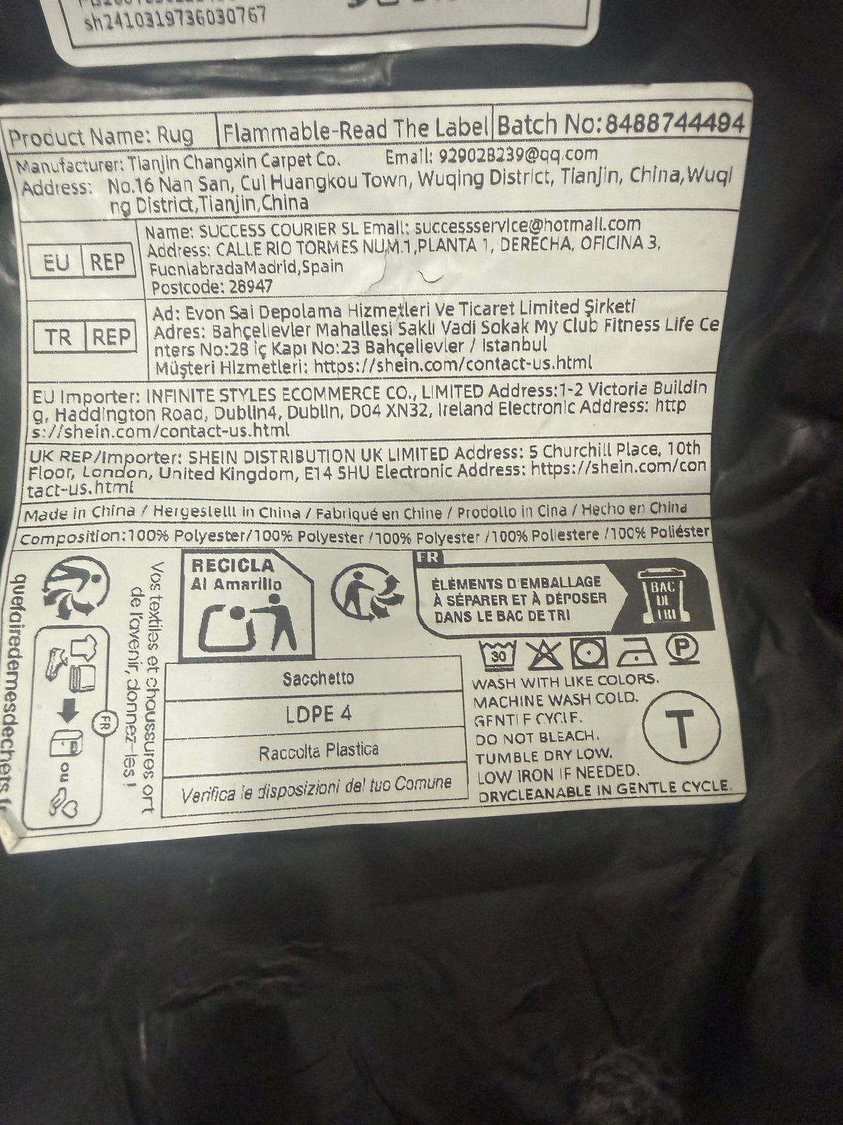 Packaging label showing polyester composition and cold gentle machine wash instructions