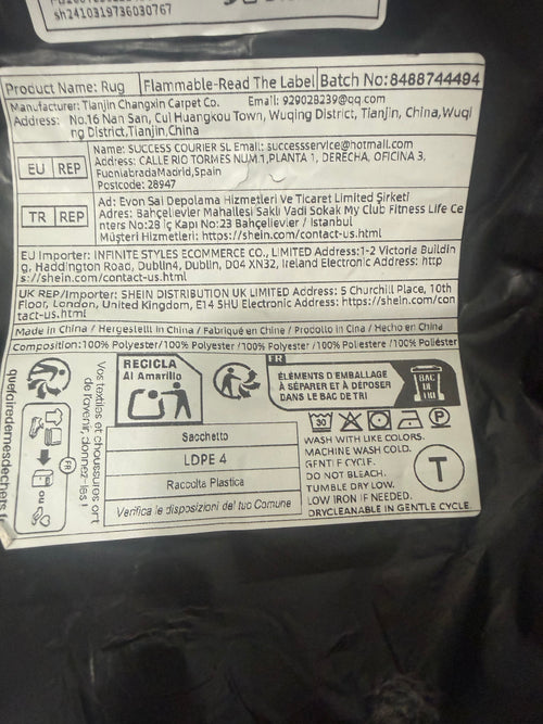 Packaging label showing polyester composition and cold gentle machine wash instructions