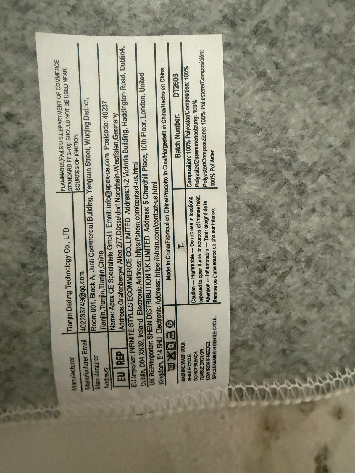 Cream patterned rug care and composition label