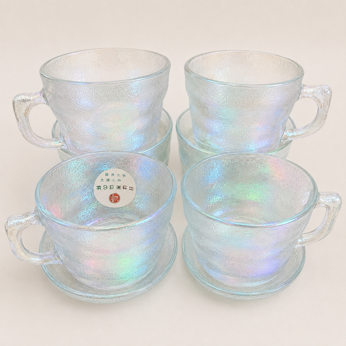 Iridescent textured glass cups with matching saucers